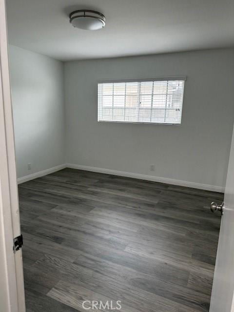13305 Cordary Ave, Hawthorne, CA 90250 - empty room with dark wood-style floors and baseboards