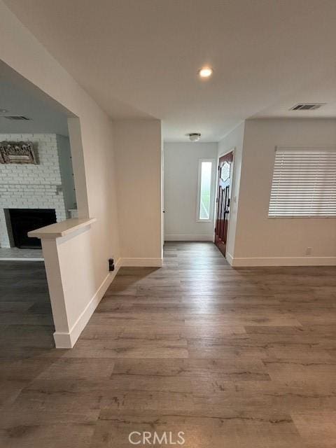 13305 Cordary Ave, Hawthorne, CA 90250 - unfurnished living room featuring wood finished floors, a fireplace, and recessed lighting