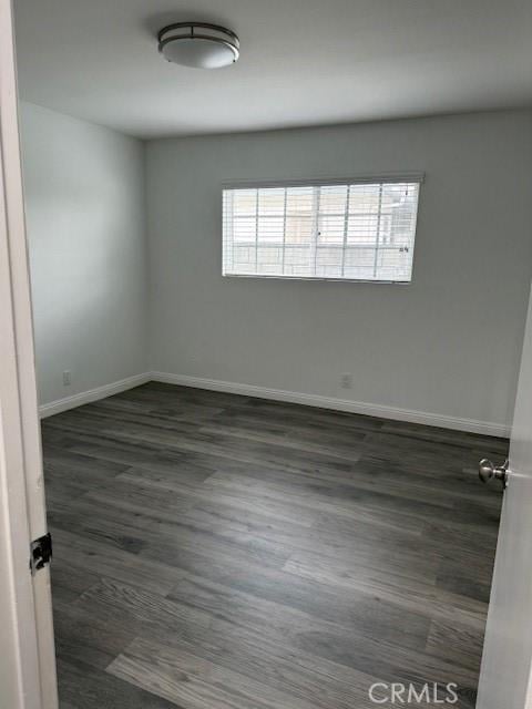 13305 Cordary Ave, Hawthorne, CA 90250 - spare room featuring dark wood-type flooring and baseboards
