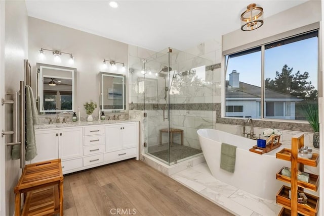 5 Creek View Rd, Coto De Caza, CA 92679 - bathroom featuring double vanity, a freestanding tub, a shower stall, and a sink