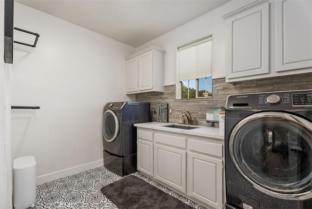 5 Creek View Rd, Coto De Caza, CA 92679 - clothes washing area with washing machine and dryer, cabinet space, a sink, baseboards, and light tile patterned floors