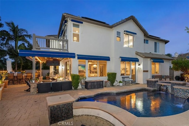 5 Creek View Rd, Coto De Caza, CA 92679 - back of property featuring stucco siding, an outdoor pool, an in ground hot tub, a patio area, and a balcony
