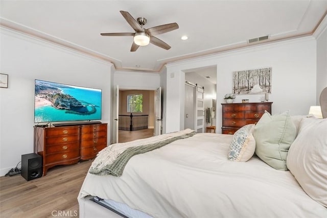 5 Creek View Rd, Coto De Caza, CA 92679 - bedroom with a ceiling fan, visible vents, crown molding, a barn door, and light wood finished floors