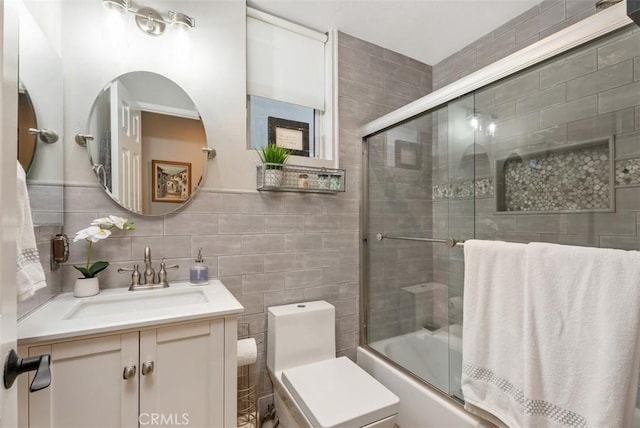 5 Creek View Rd, Coto De Caza, CA 92679 - bathroom featuring shower / bath combination with glass door, toilet, tile walls, and vanity