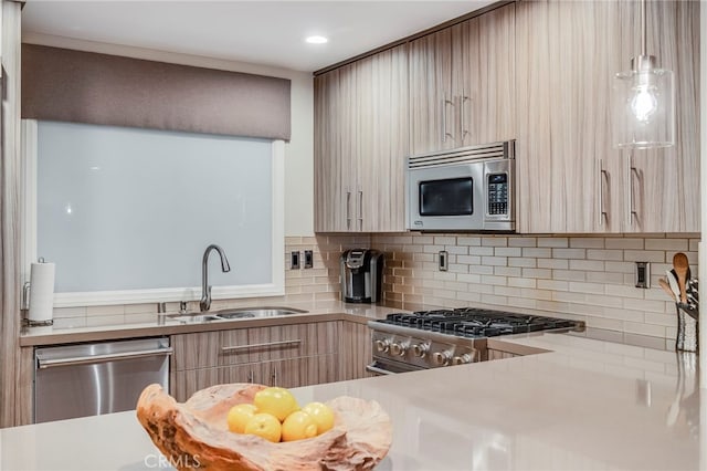 247 Calliope St, Laguna Beach, CA 92651 - kitchen featuring stainless steel appliances, a sink, modern cabinets, decorative backsplash, and recessed lighting