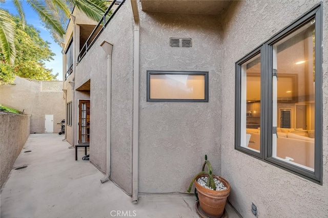 247 Calliope St, Laguna Beach, CA 92651 - view of side of home with stucco siding and a patio area