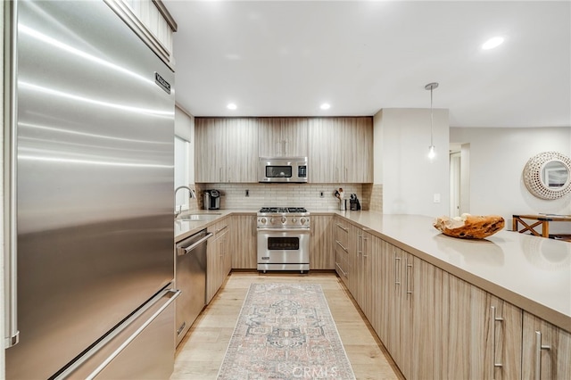 247 Calliope St, Laguna Beach, CA 92651 - kitchen with high quality appliances, light brown cabinetry, a sink, light countertops, and recessed lighting