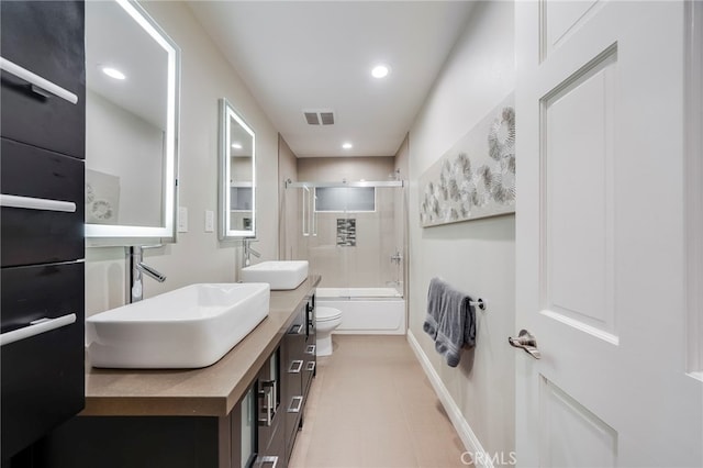 247 Calliope St, Laguna Beach, CA 92651 - bathroom with toilet, enclosed tub / shower combo, double vanity, baseboards, and recessed lighting