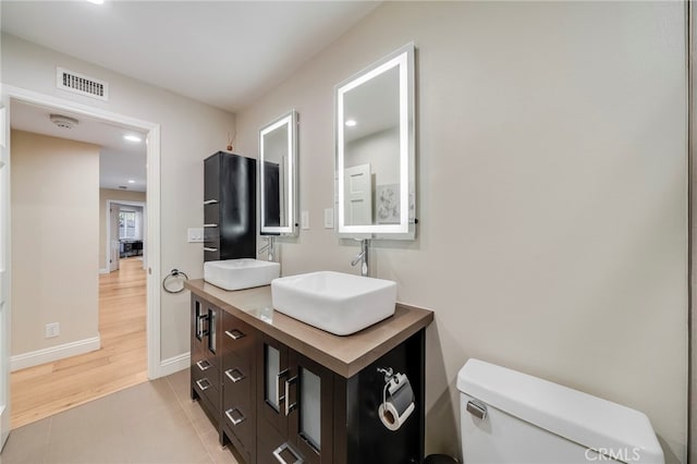 247 Calliope St, Laguna Beach, CA 92651 - bathroom with toilet, double vanity, baseboards, recessed lighting, and tile patterned floors