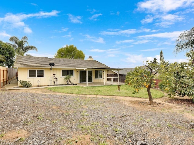 950 E Elder St, Fallbrook, CA 92028 - rear view of property with a chimney, a patio area, a tile roof, and board and batten siding