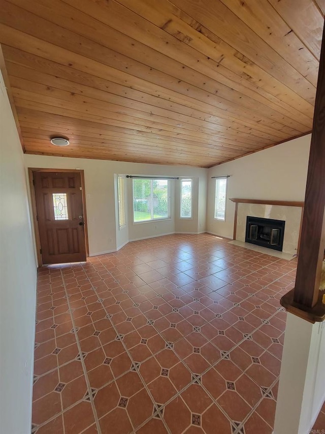 950 E Elder St, Fallbrook, CA 92028 - unfurnished living room with vaulted ceiling, wood ceiling, a fireplace with flush hearth, and baseboards