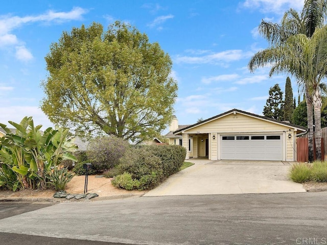 950 E Elder St, Fallbrook, CA 92028 - view of front facade featuring an attached garage, concrete driveway, and a chimney