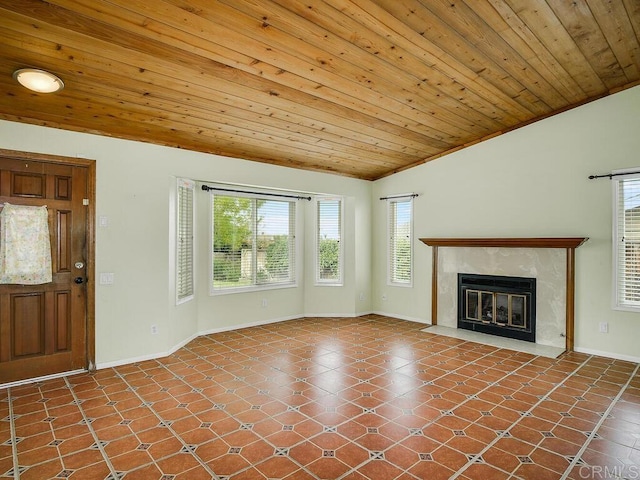 950 E Elder St, Fallbrook, CA 92028 - unfurnished living room with vaulted ceiling, wood ceiling, a high end fireplace, and baseboards