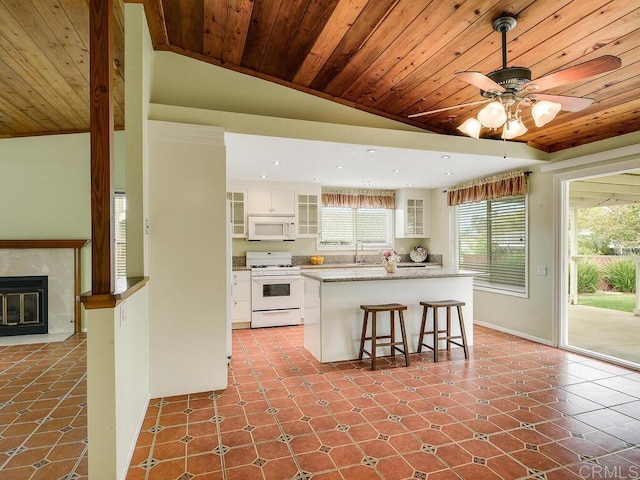 950 E Elder St, Fallbrook, CA 92028 - kitchen with white appliances, wooden ceiling, lofted ceiling, white cabinets, and ceiling fan