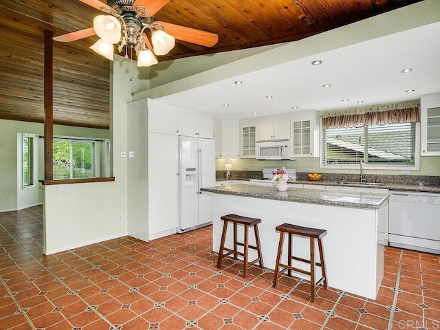 950 E Elder St, Fallbrook, CA 92028 - kitchen with white appliances, a sink, recessed lighting, ceiling fan, and a breakfast bar