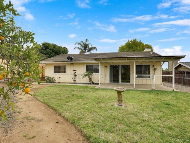 950 E Elder St, Fallbrook, CA 92028 - back of house featuring a patio, a chimney, and board and batten siding