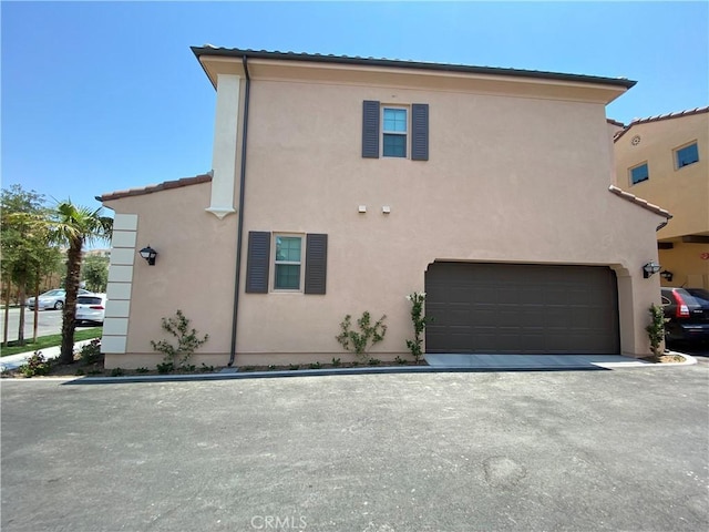 view of front of property featuring stucco siding and an attached garage