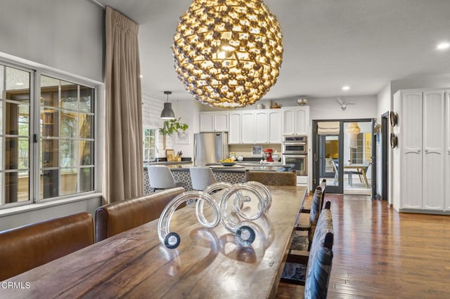 dining room featuring recessed lighting and dark wood-style flooring