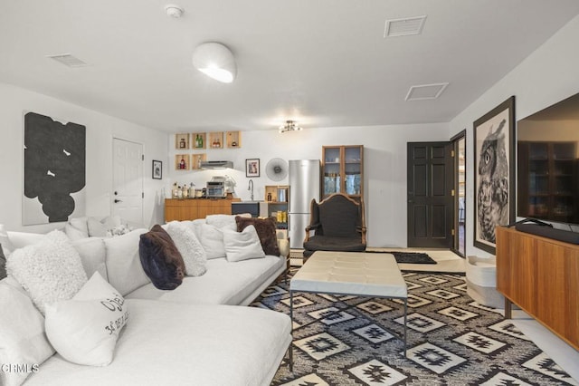 living room featuring visible vents