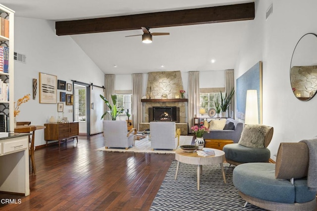 living room featuring ceiling fan, beam ceiling, visible vents, and plenty of natural light
