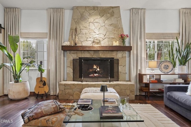 sitting room with hardwood / wood-style floors and a fireplace