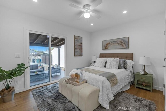 bedroom with baseboards, access to outside, recessed lighting, and wood finished floors