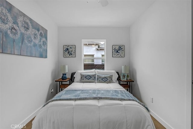 433 N Buena Vista St, Burbank, CA 91505 - bedroom featuring baseboards, wood finished floors, and a ceiling fan