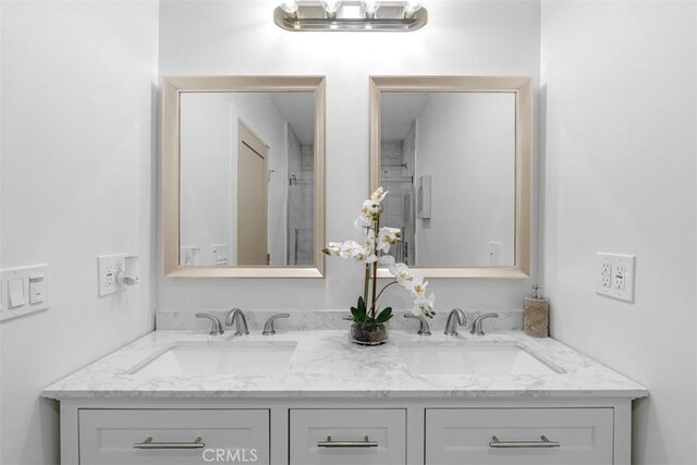 bathroom with double vanity and a sink