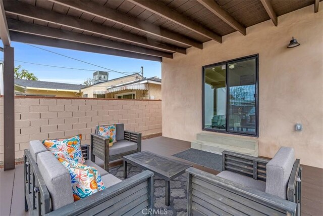 deck with fence, an outdoor living space, a patio area, and entry steps