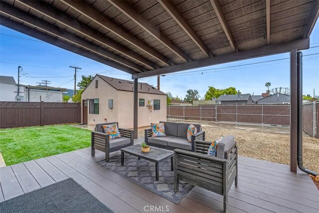 deck with a lawn, a fenced backyard, and outdoor lounge area