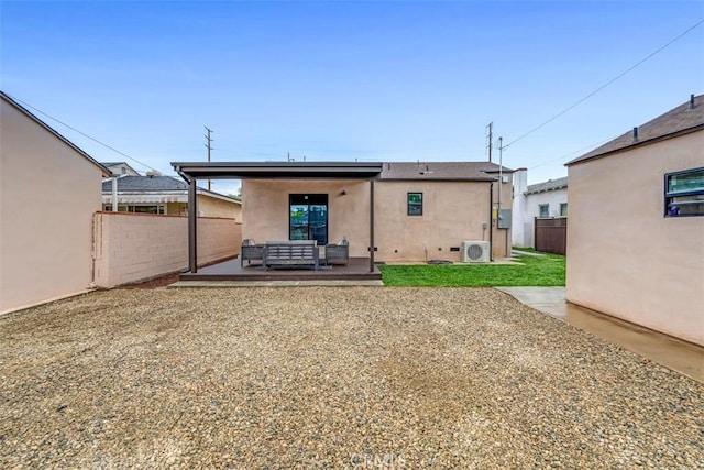 433 N Buena Vista St, Burbank, CA 91505 - back of property featuring stucco siding, a cooling unit, outdoor lounge area, and a patio