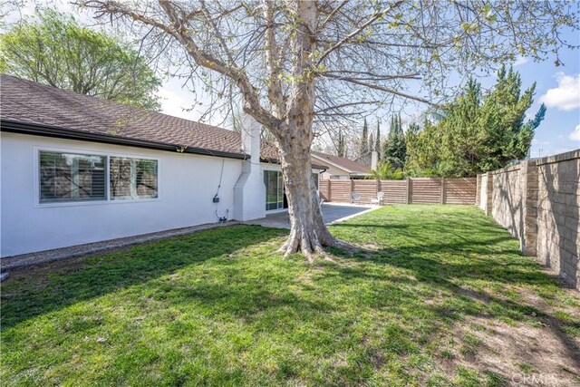 view of yard featuring a fenced backyard and a patio area