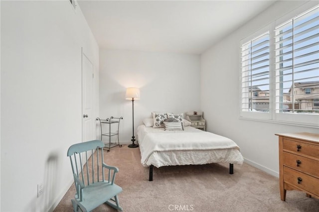 carpeted bedroom with baseboards