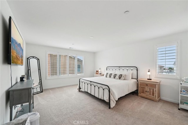 bedroom with baseboards and carpet floors
