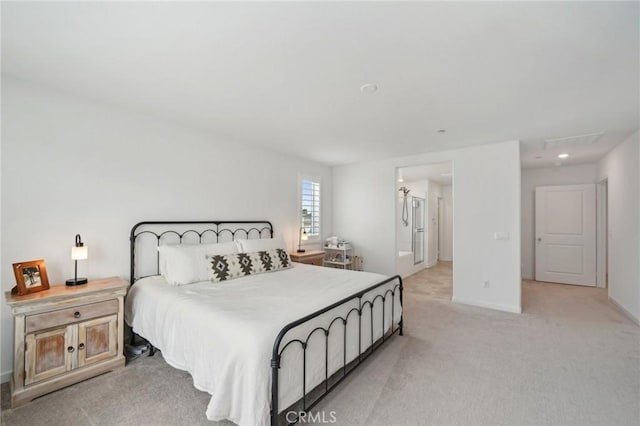 bedroom featuring baseboards and light colored carpet
