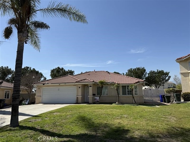 view of front of home with an attached garage, stucco siding, a tile roof, a front lawn, and driveway