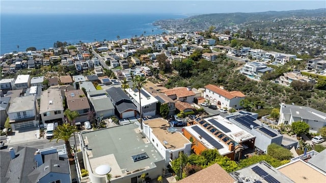 drone / aerial view featuring a residential view and a water view