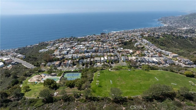 drone / aerial view featuring a water view and a residential view