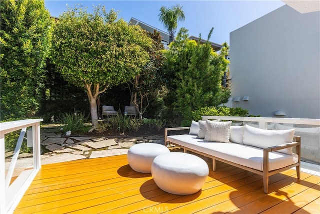wooden deck with an outdoor living space