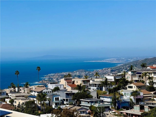 water view with a residential view and a mountain view