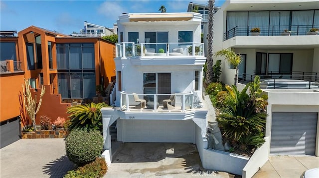exterior space featuring a balcony and stucco siding