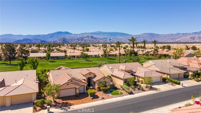 drone / aerial view featuring a mountain view and a residential view