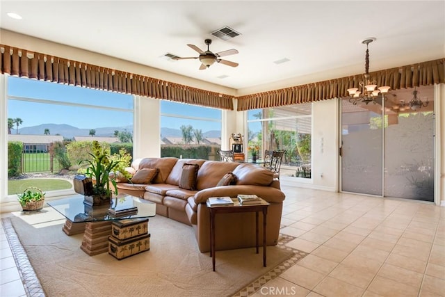 living area featuring a mountain view, visible vents, and light tile patterned floors