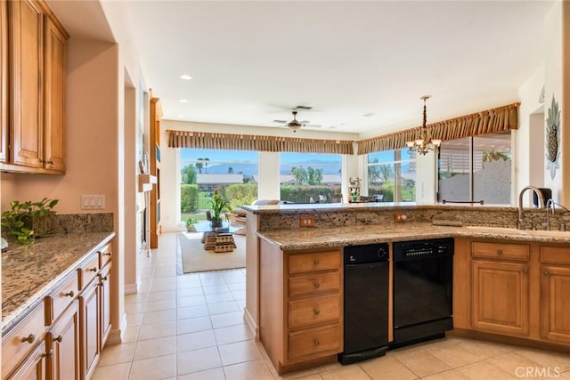 kitchen featuring a sink, light stone counters, light tile patterned floors, and dishwasher