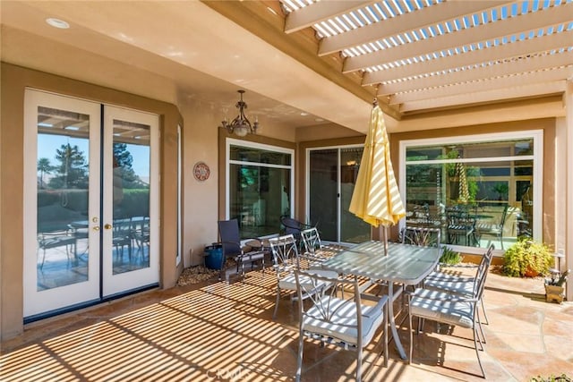 view of patio featuring french doors, a pergola, and outdoor dining space