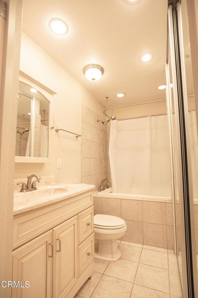 full bathroom featuring tile patterned flooring, vanity, recessed lighting, toilet, and tiled shower / bath