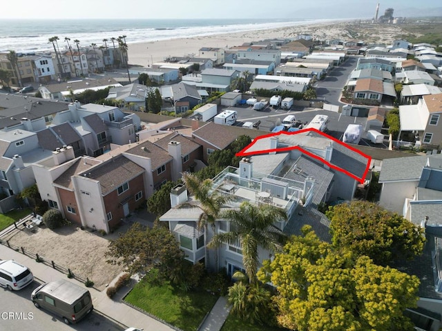 bird's eye view with a view of the beach, a residential view, and a water view
