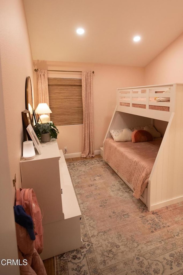 bedroom featuring baseboards and recessed lighting
