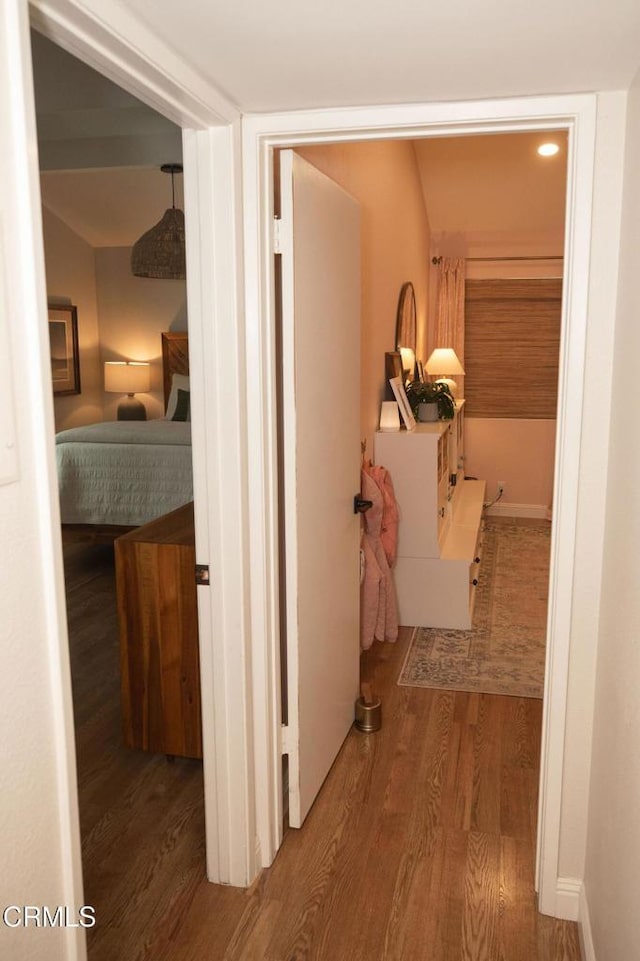 hall with wood finished floors