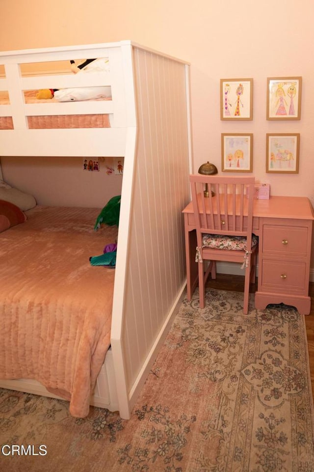 bedroom with wood finished floors
